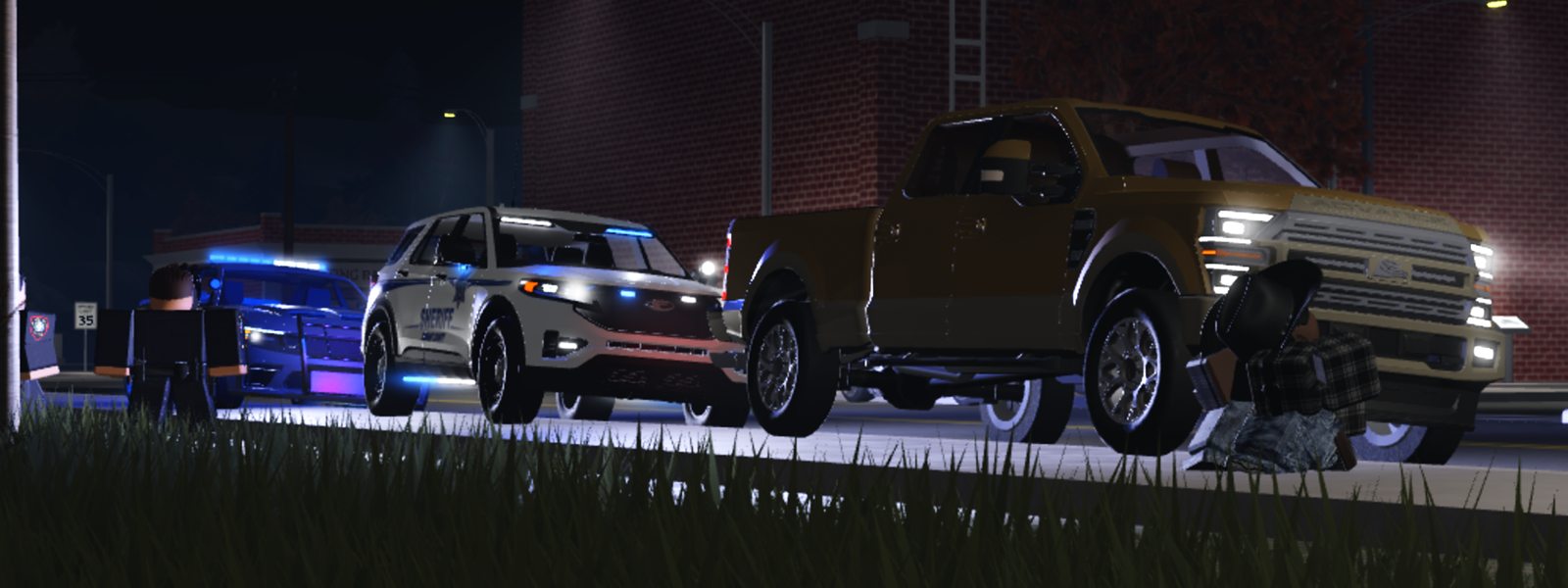A traffic stop at night: a sheriff’s SUV behind a pickup truck, a deputy watching from the roadside